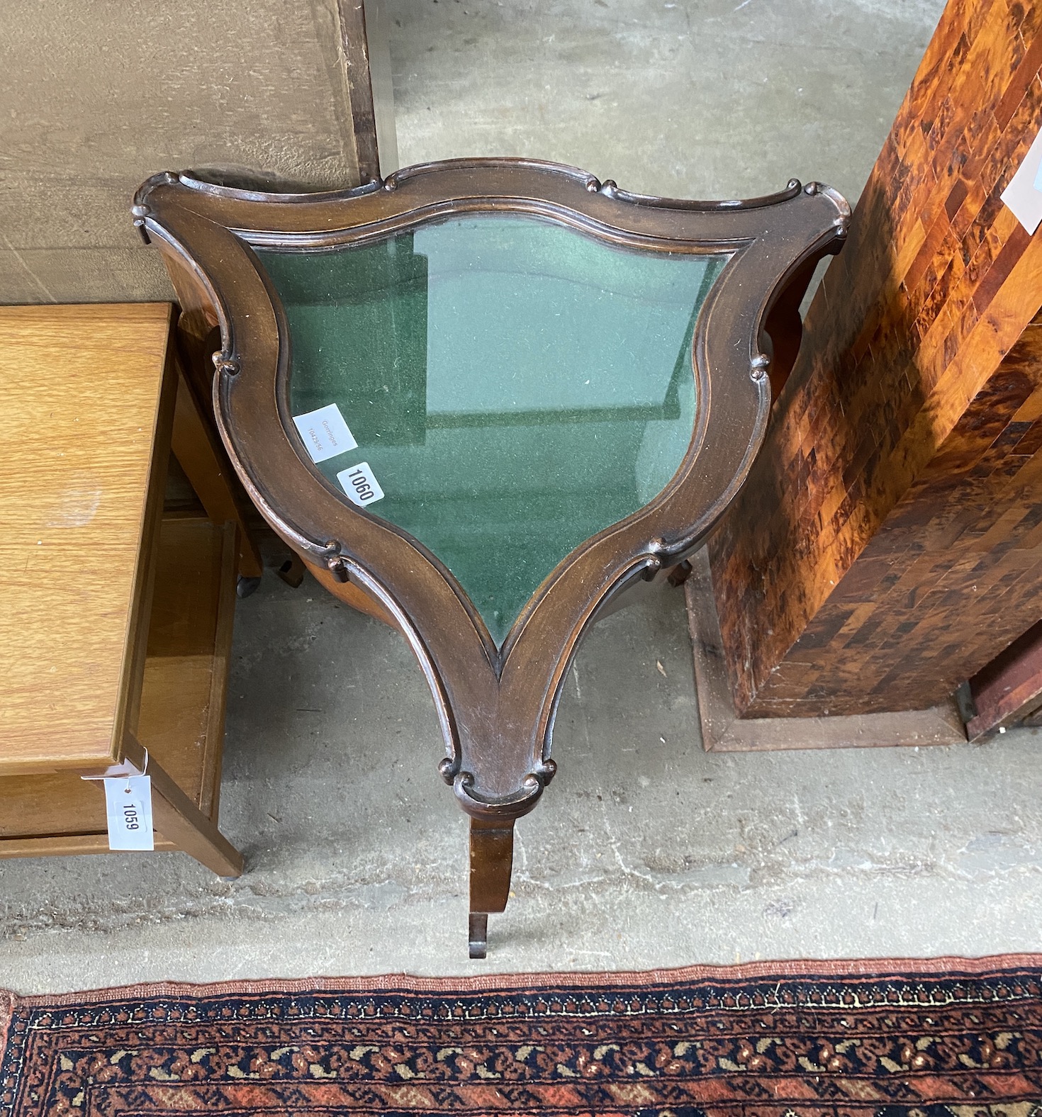 A Victorian mahogany bijouterie table of shaped triangular form, width 52cm, height 74cm